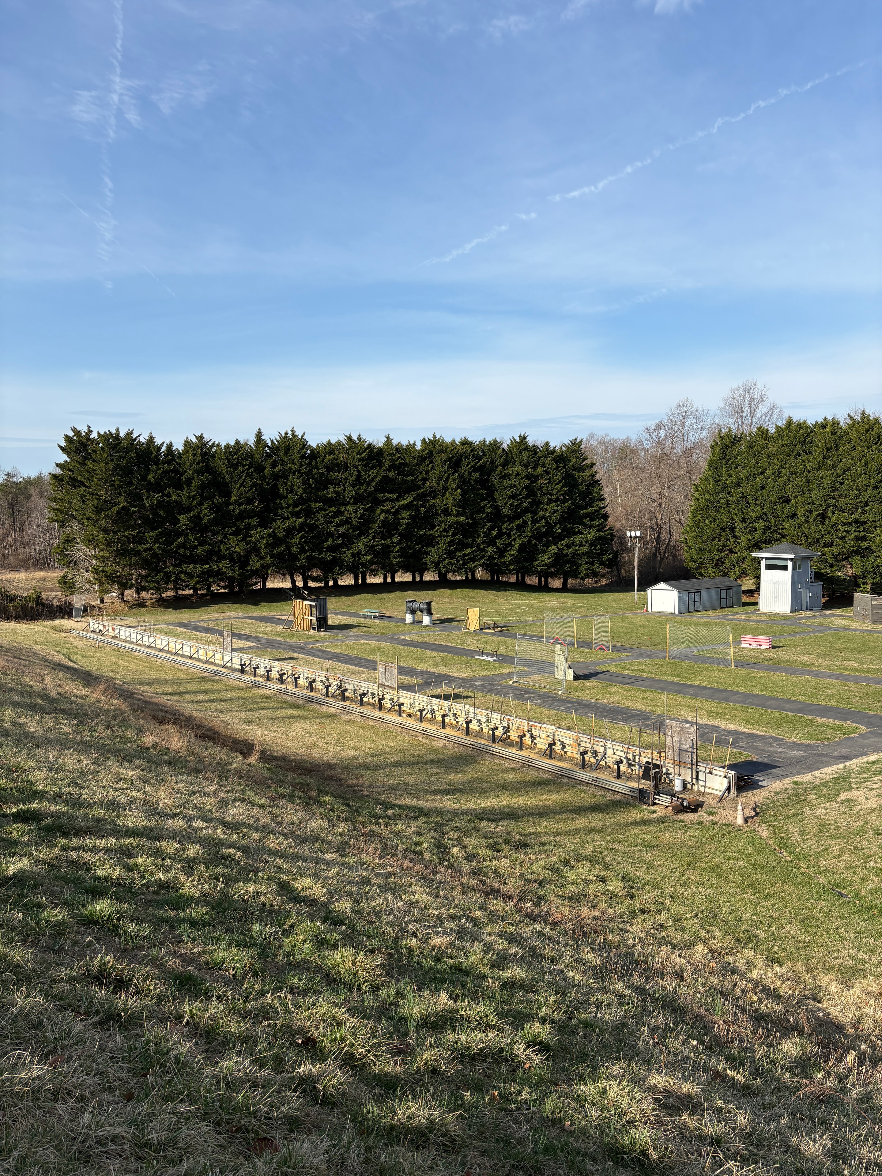 Outdoor range facility with berms and training grounds